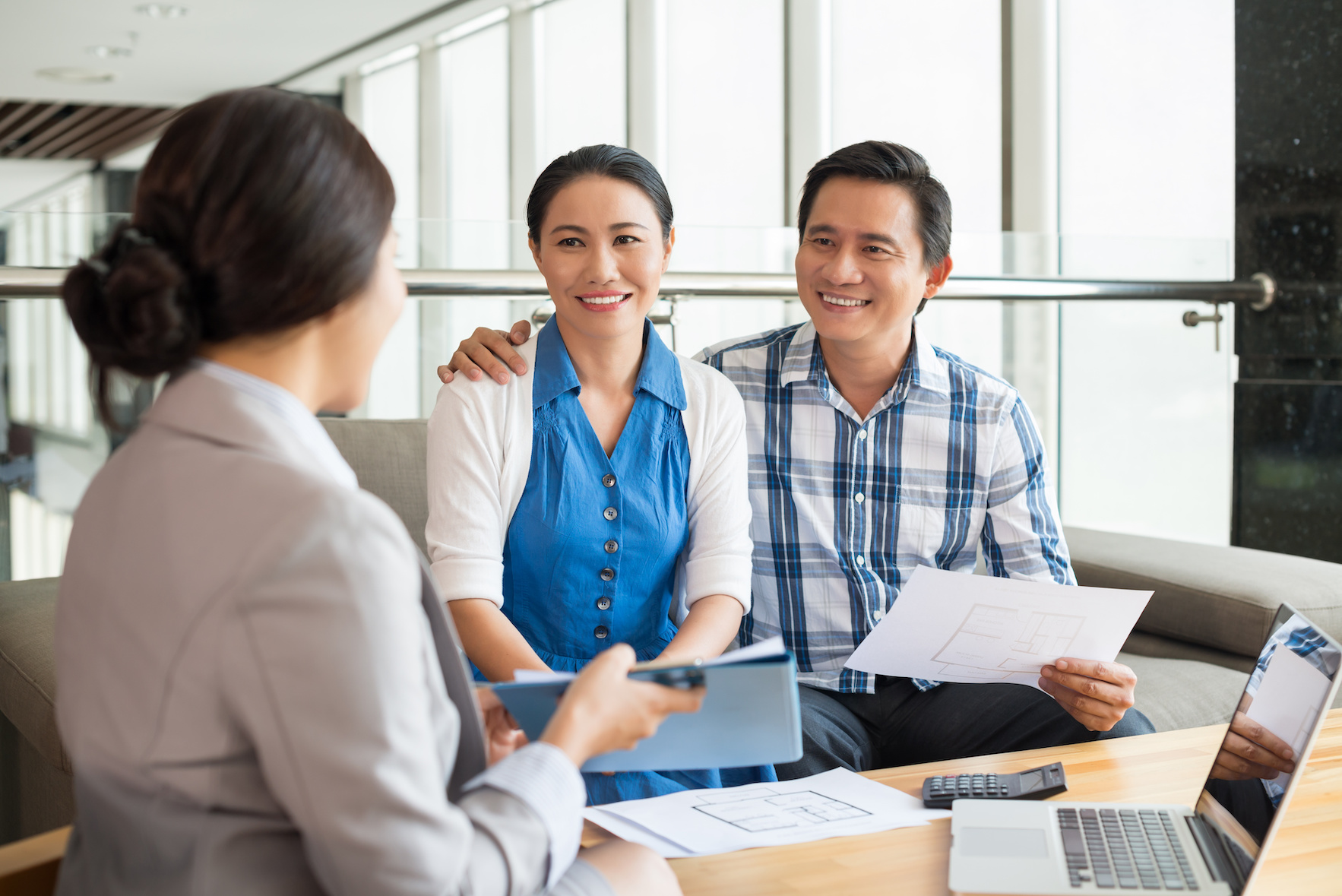 Middle-aged couple at the meeting with real estate agent